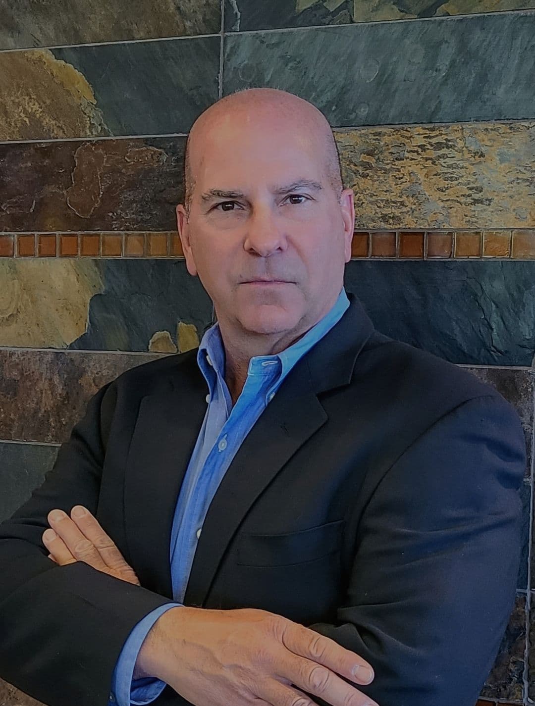 Professional headshot of Guy White